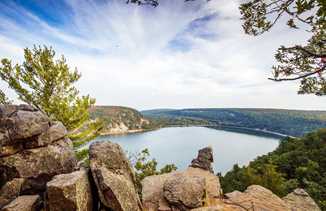 https://www.travelwisconsin.com/uploads/blog/b1/b1141a55-06b5-4689-acde-8fa021a64a3a-100-scenic-overlook-of-devils-lake-at-devils-lake-state-park_retouch.jpg?preset=more-to-explore