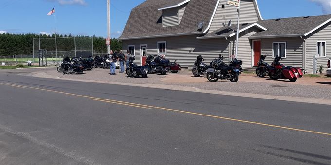 Motorcyclists getting ready to ride outside of Held&#39;s Bar.