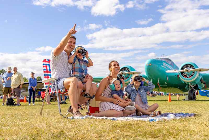 family watching the air show at EAA airventure in oshkosh