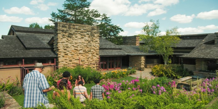 group of people walking the grounds at Taliesin