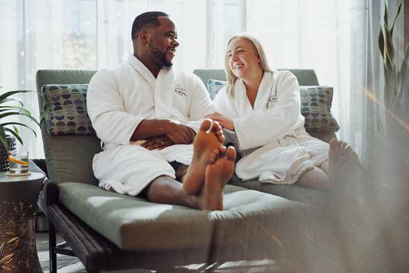 couple relaxing on a couch at spa retreat