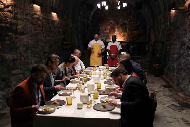 top chef judges eating dinner in the miller caves at miller brewing company